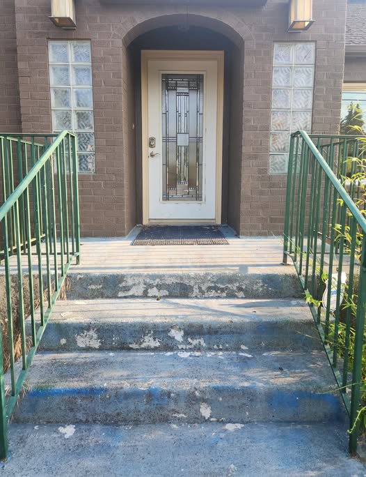 A few steps leading up to a homey front door